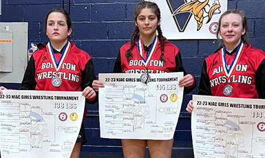  girls display wrestling awards